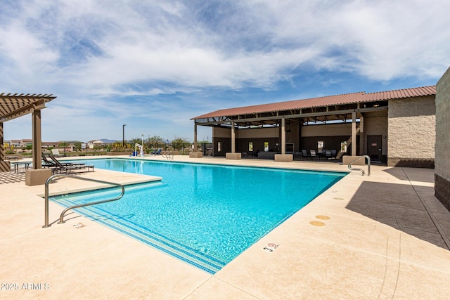 community pool with outdoor lounge area, fence, a pergola, and a patio area