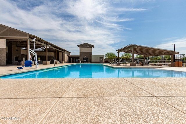 pool with fence and a patio