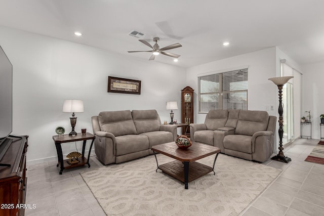 living area with a ceiling fan, light tile patterned flooring, and recessed lighting