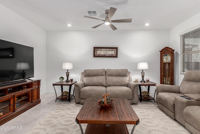 living area with baseboards, visible vents, recessed lighting, and a ceiling fan