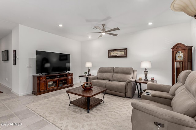 living room with light tile patterned floors, recessed lighting, baseboards, and ceiling fan