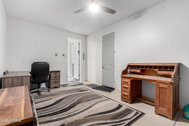 office space featuring concrete flooring and ceiling fan