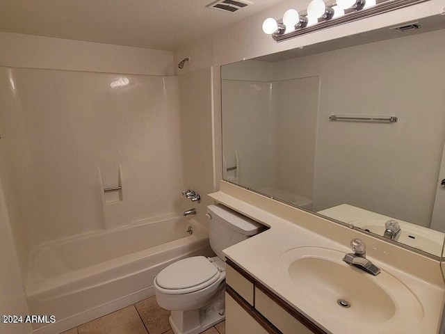 full bathroom with vanity, toilet, tile patterned floors, and shower / washtub combination