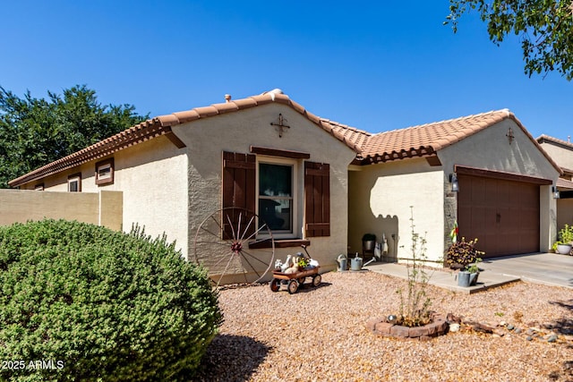 14112 W Larkspur Dr, Surprise, AZ 85379 - mediterranean / spanish-style home featuring a tile roof, a garage, stucco siding, fence, and concrete driveway