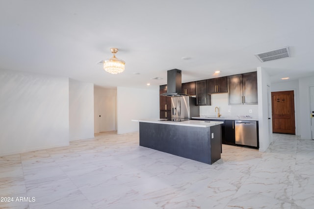 kitchen featuring sink, appliances with stainless steel finishes, dark brown cabinets, a kitchen island with sink, and island exhaust hood