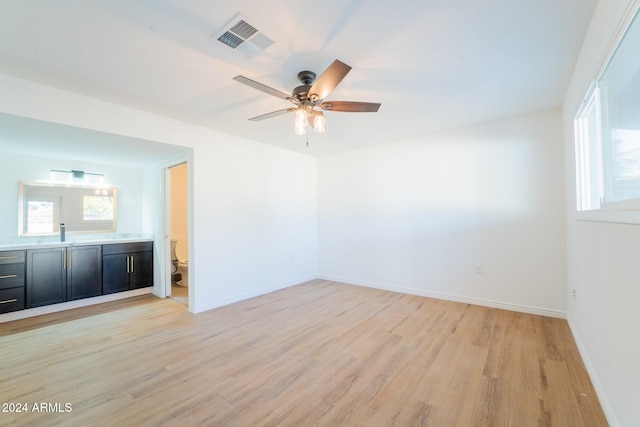 unfurnished room with ceiling fan and light hardwood / wood-style flooring