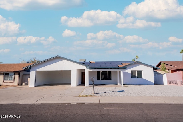 view of front of house with solar panels