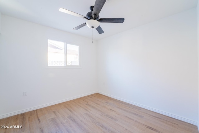 spare room featuring light hardwood / wood-style floors and ceiling fan