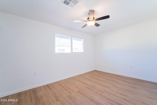 unfurnished room featuring light hardwood / wood-style floors and ceiling fan