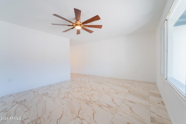 spare room featuring ceiling fan