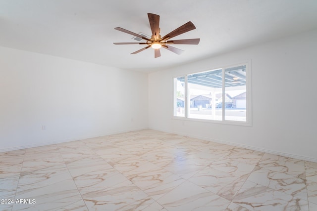 spare room with ceiling fan