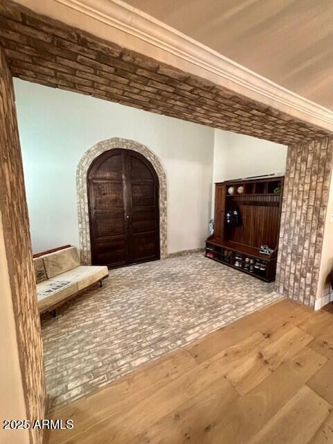 unfurnished room with wood-type flooring