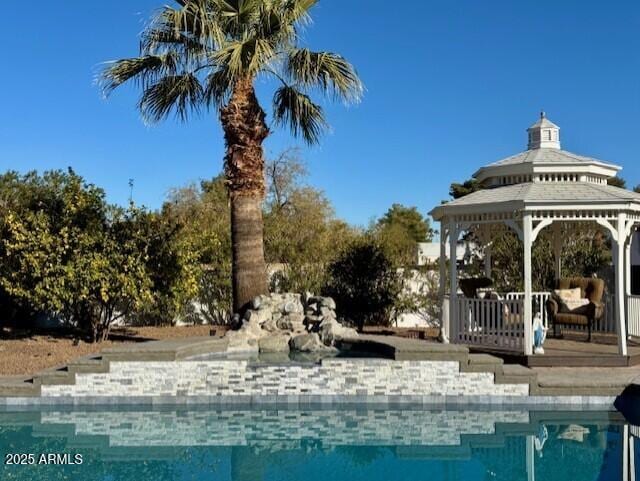 view of swimming pool featuring a gazebo