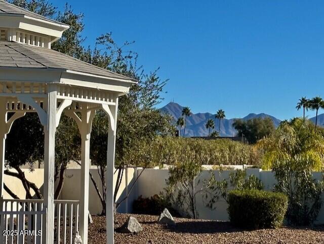 exterior space with a mountain view and a gazebo