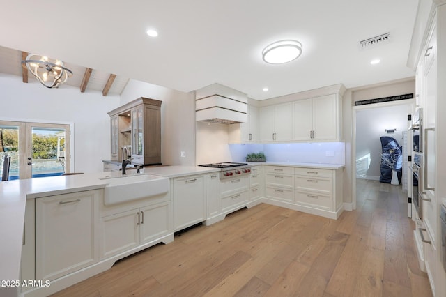 kitchen featuring white cabinetry, appliances with stainless steel finishes, and sink