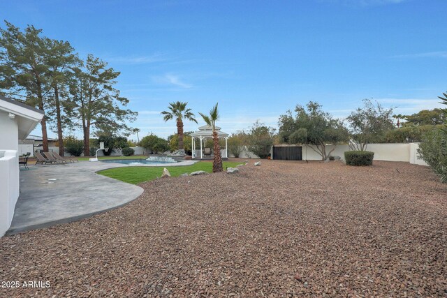 view of yard featuring a gazebo and a patio area