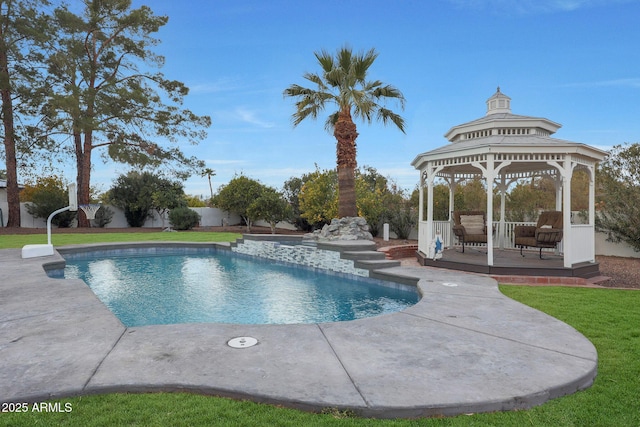 view of swimming pool featuring a gazebo, a yard, and a deck