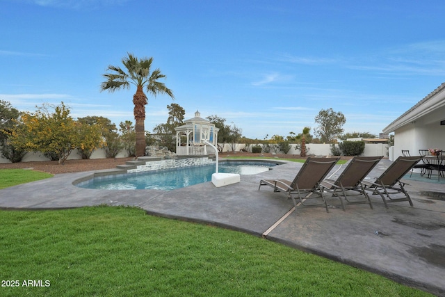 view of swimming pool featuring a patio and a lawn