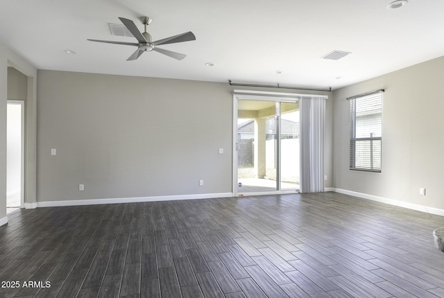 spare room with ceiling fan and dark hardwood / wood-style flooring