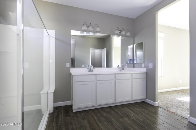 bathroom featuring wood-type flooring and vanity