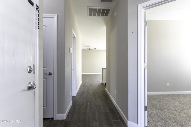 corridor featuring dark hardwood / wood-style flooring