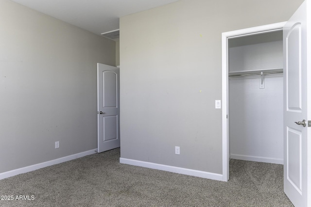 unfurnished bedroom with a closet and carpet