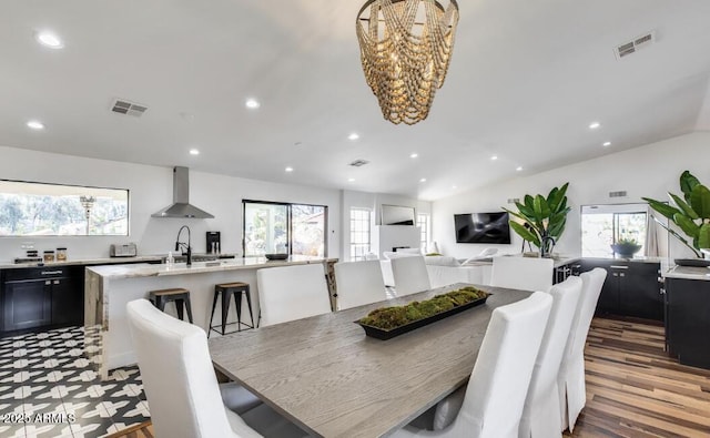 dining area with a healthy amount of sunlight, visible vents, vaulted ceiling, and recessed lighting