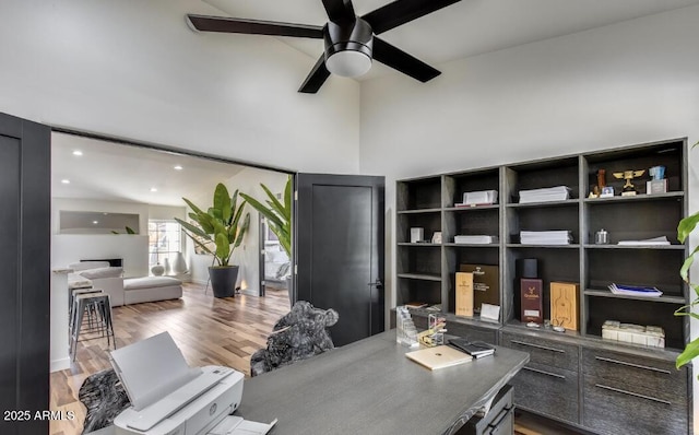 office area with a ceiling fan, wood finished floors, and recessed lighting