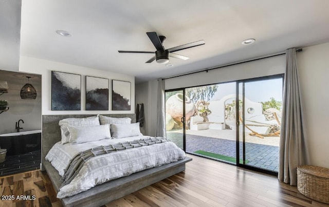 bedroom featuring access to exterior, a ceiling fan, recessed lighting, and wood finished floors