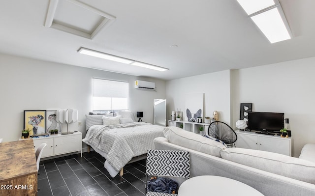 bedroom with a wall mounted AC and attic access