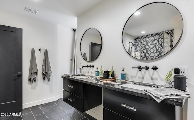 full bathroom with double vanity, tile patterned flooring, visible vents, and baseboards