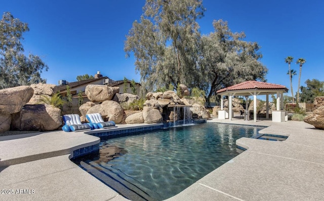 outdoor pool featuring a patio area and a gazebo