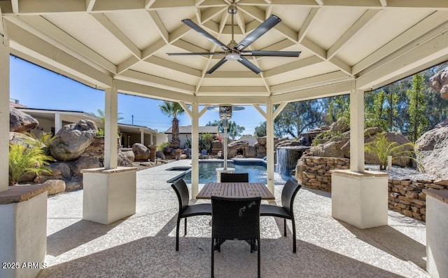 view of patio featuring a gazebo, outdoor dining space, and a fenced in pool