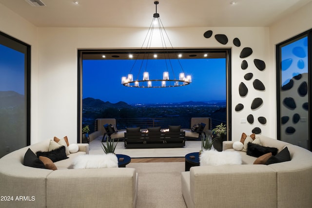 cinema room featuring hardwood / wood-style floors and a chandelier