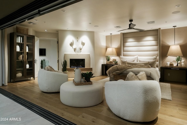 bedroom featuring ceiling fan and light hardwood / wood-style flooring