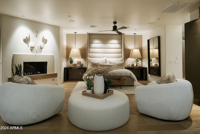 bedroom featuring ceiling fan and light hardwood / wood-style flooring