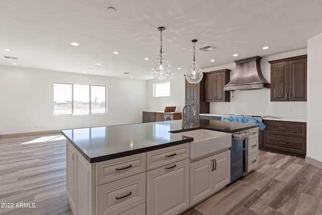 0000 W Hooper Trl Unit 3, Queen Creek, AZ 85144 - kitchen with stainless steel dishwasher, visible vents, premium range hood, and a sink