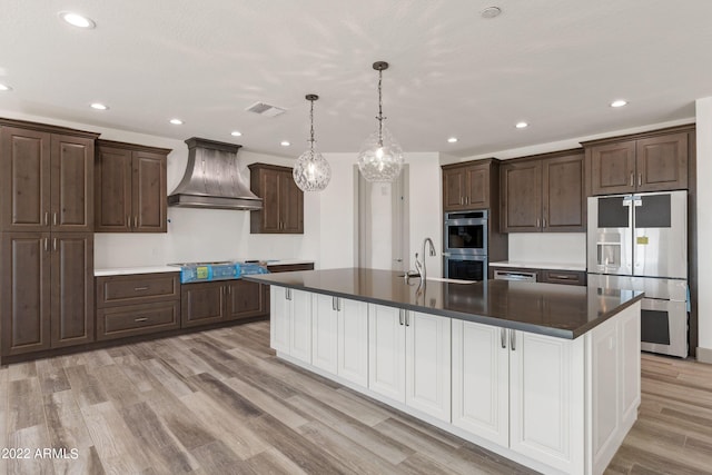 0000 W Hooper Trl Unit 3, Queen Creek, AZ 85144 - kitchen with visible vents, stainless steel double oven, stovetop, custom range hood, and fridge with ice dispenser