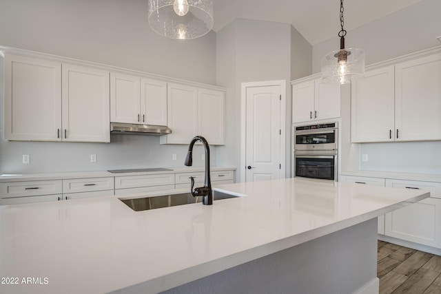 0000 W Hooper Trl Unit 3, Queen Creek, AZ 85144 - kitchen with a sink, double oven, under cabinet range hood, and white cabinets