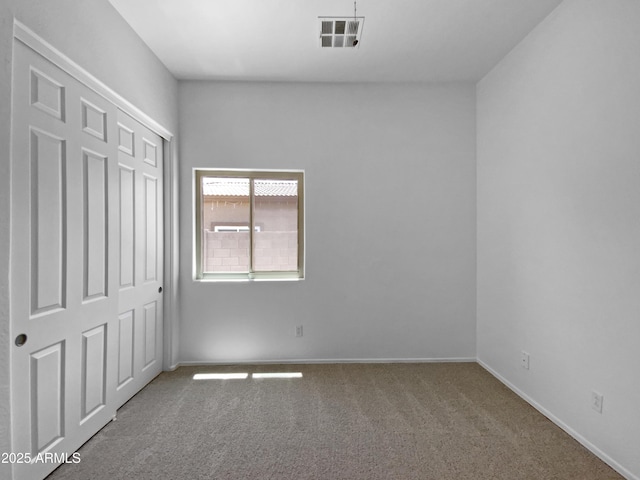 2971 N Rosewood Ave, Casa Grande, AZ 85122 - unfurnished bedroom with carpet floors, baseboards, and a closet