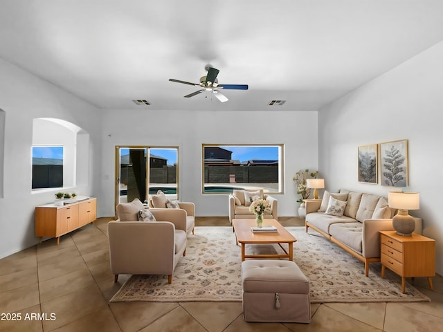 2971 N Rosewood Ave, Casa Grande, AZ 85122 - living area featuring light tile patterned floors, a ceiling fan, and arched walkways