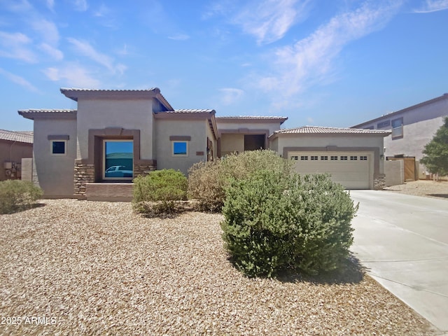 2971 N Rosewood Ave, Casa Grande, AZ 85122 - mediterranean / spanish house featuring stucco siding, driveway, an attached garage, and a tiled roof