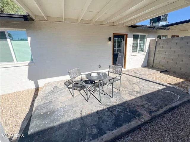 view of patio / terrace featuring outdoor dining area and fence