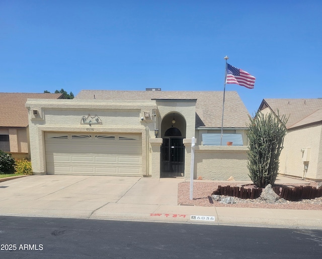 6036 W Mescal St, Glendale, AZ 85304 - view of front of home featuring an attached garage, concrete driveway, and stucco siding