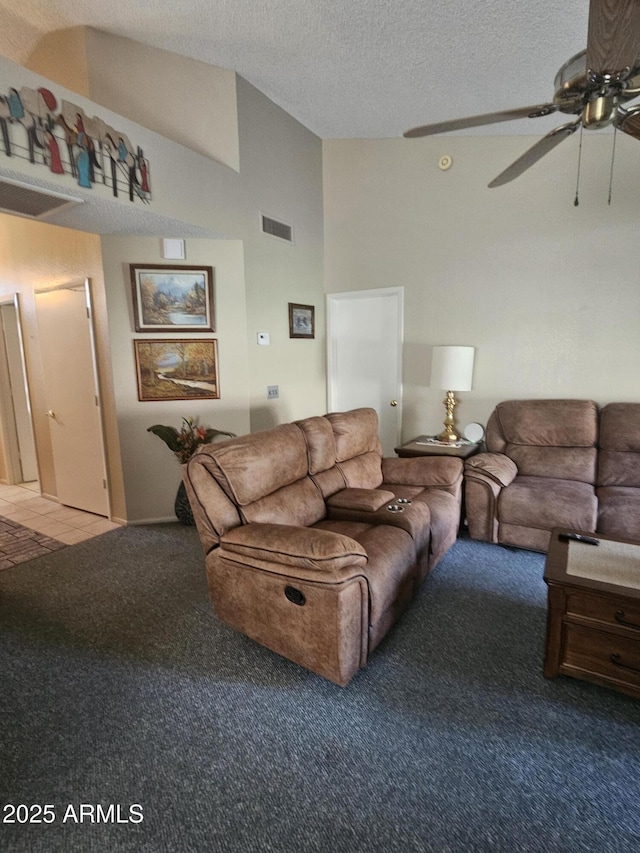 6036 W Mescal St, Glendale, AZ 85304 - carpeted living room featuring ceiling fan, lofted ceiling, and a textured ceiling