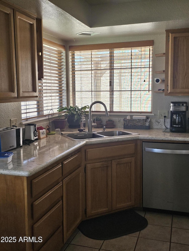 6036 W Mescal St, Glendale, AZ 85304 - kitchen with stainless steel dishwasher, a sink, tile patterned floors, light countertops, and open shelves