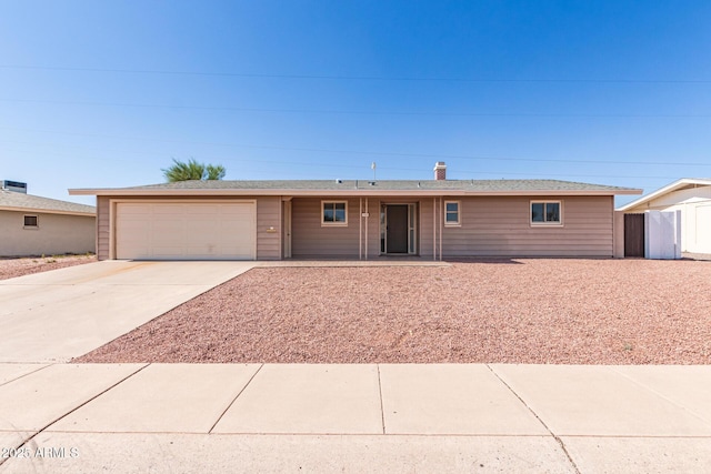 6022 E Colby St, Mesa, AZ 85205 - single story home with a garage, driveway, and a chimney