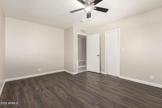 6022 E Colby St, Mesa, AZ 85205 - spare room with dark wood-style flooring, a ceiling fan, and a smoke detector