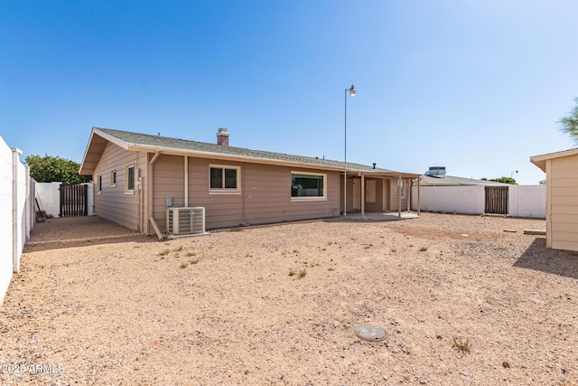 6022 E Colby St, Mesa, AZ 85205 - rear view of property featuring a fenced backyard, a gate, a patio area, and a chimney