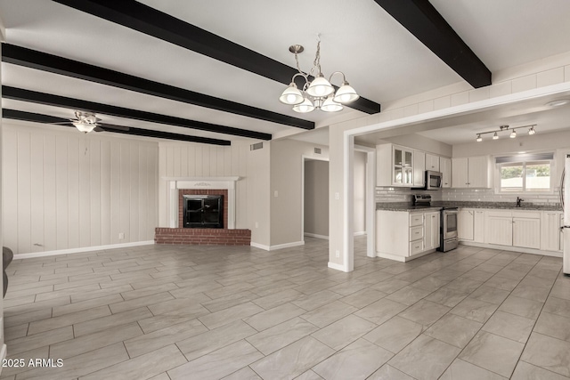 6022 E Colby St, Mesa, AZ 85205 - unfurnished living room featuring beam ceiling, a chandelier, a brick fireplace, and a ceiling fan